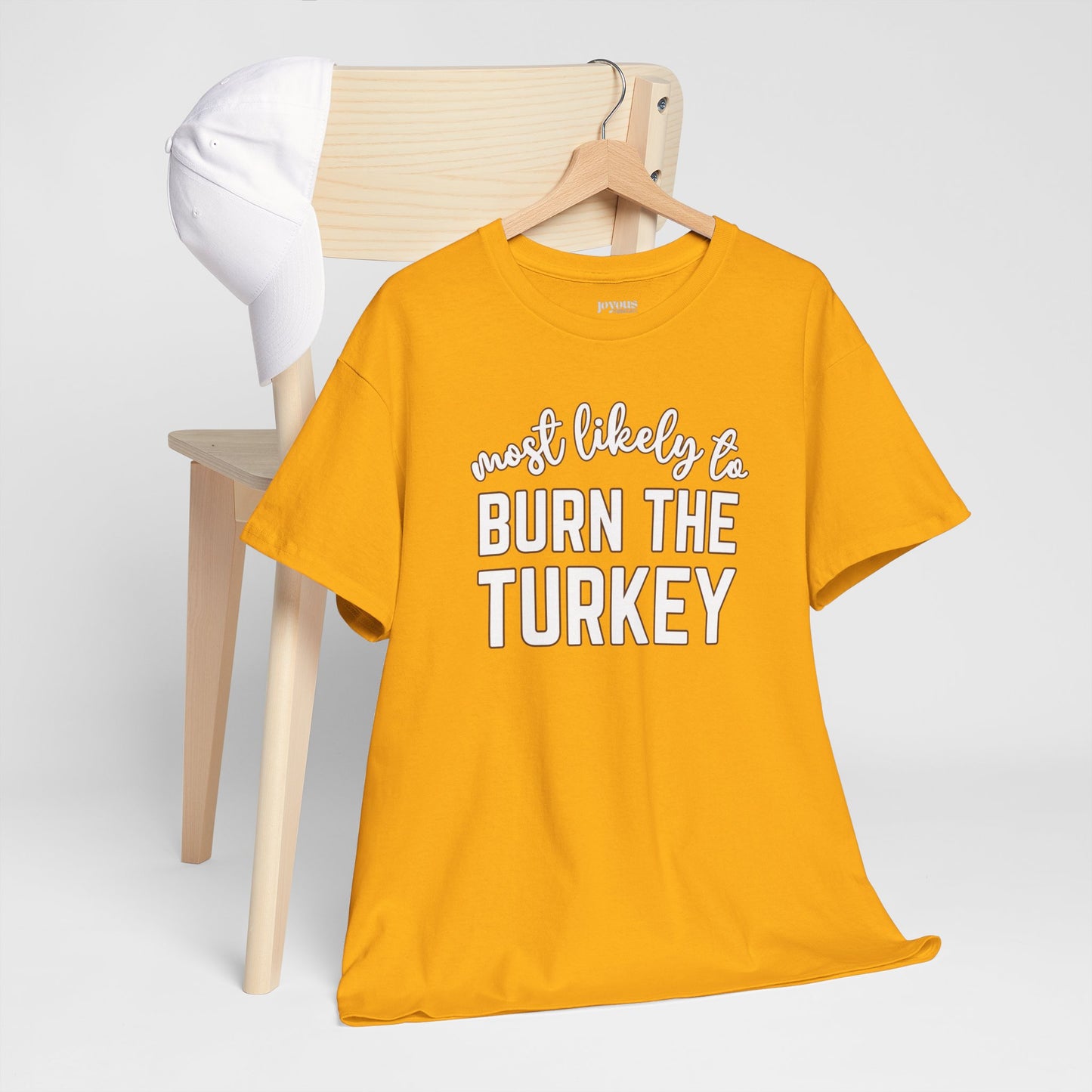 Funny Thanksgiving Shirt - Most likely to Burn the Turkey Heavy Cotton Tee