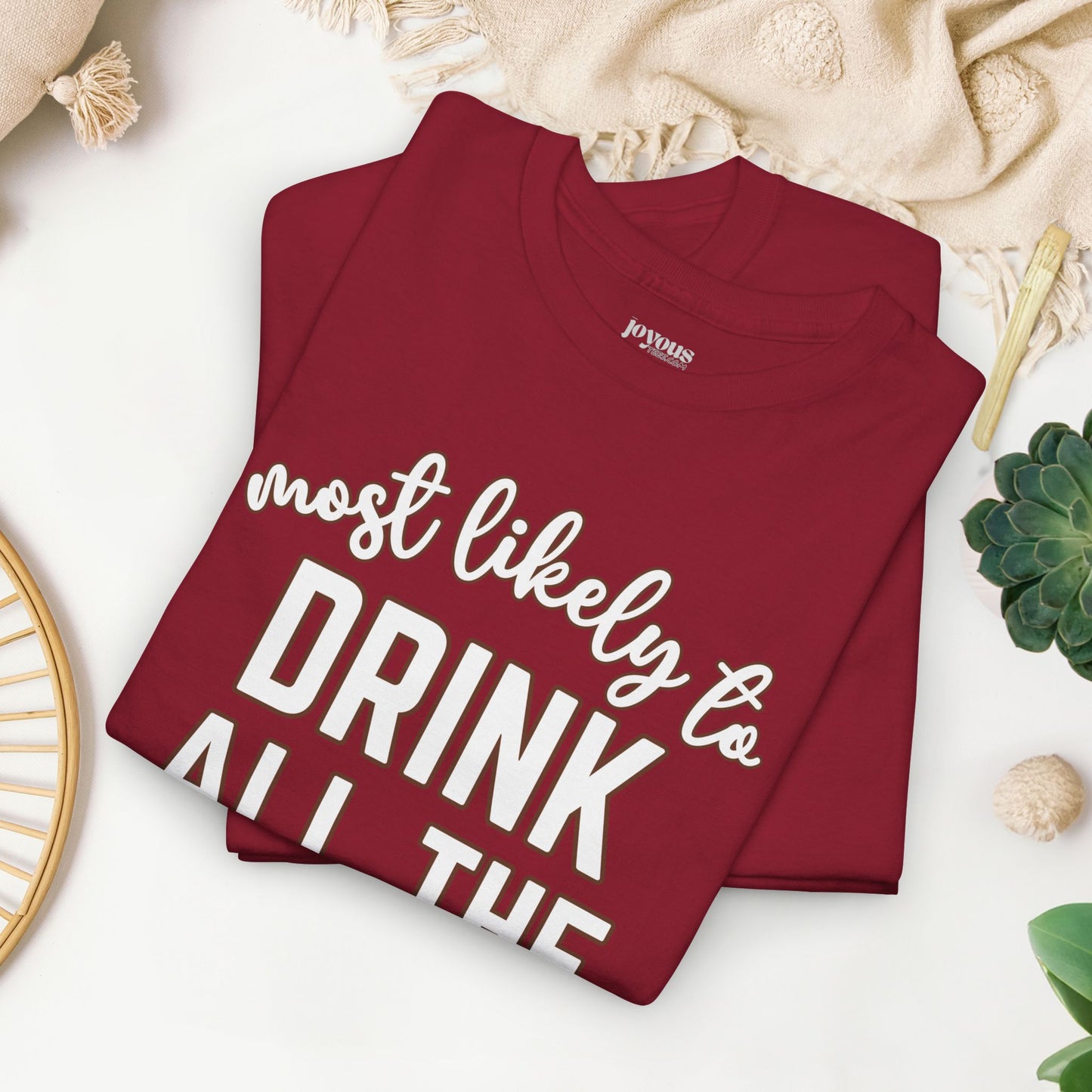 Funny Thanksgiving Shirt - Most Likely to Drink All The Booze Heavy Cotton Tee