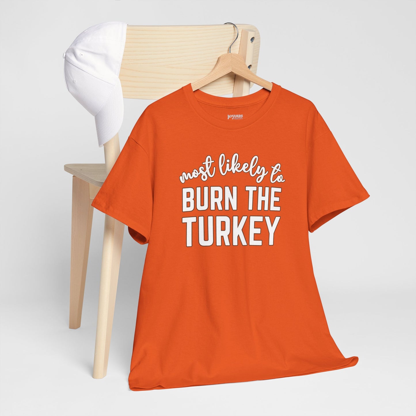 Funny Thanksgiving Shirt - Most likely to Burn the Turkey Heavy Cotton Tee